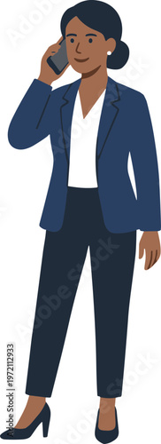 A woman in business attire talking on the phone standing alone indoors.