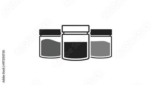 Three simple glass jars with dark lids and varying contents in grayscale showing a minimalist product storage concept.
