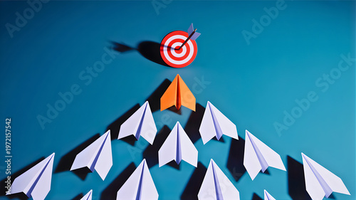 Innovative business strategy with a leading arrow-shaped paper plane aiming for a target, symbolizing success and ambition