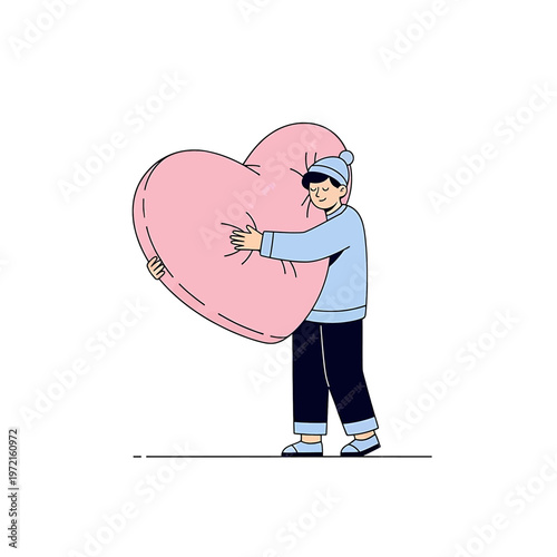 Boy holding large pink heart shaped.