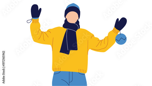 Person dressed in warm winter clothing like a yellow sweater and blue scarf holding up a festive blue holiday ornament.