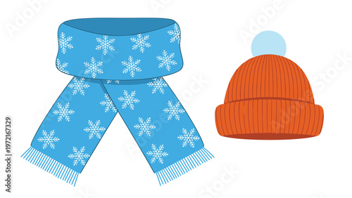 Set of blue scarf with white snowflake patterns and an orange beanie hat with a pompom for winter season clothing and warmth.