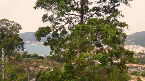 Aerial view beautiful Patong Beach in Phuket Thailand, Landscape of patong city phuket in sunny summer day time, Beautiful tropical sea,High angle view Sea beach Sunset in the evening