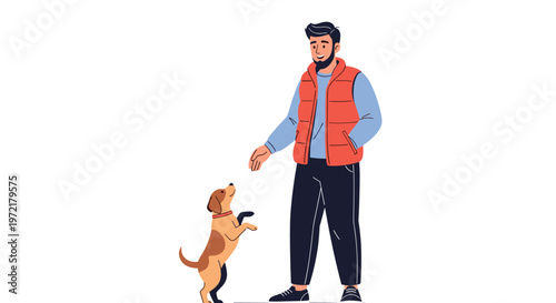 Man in casual outdoor clothes training his small brown and white dog to sit and stay while standing against a plain white background.