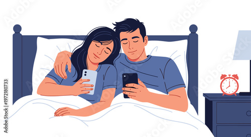 Young couple lying in bed at night under a white duvet both absorbed in their own smartphone screens instead of interacting together.