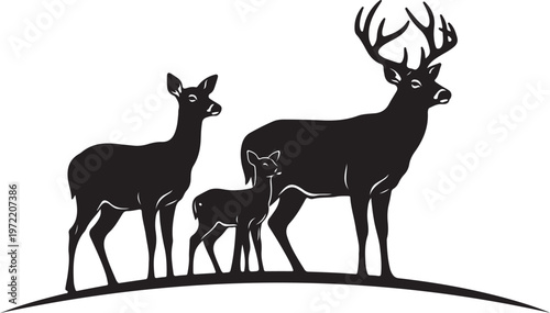Family of deer standing together on a hill silhouette