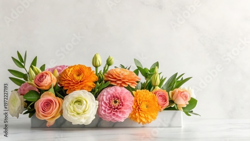 A beautiful pink and orange bouquet of tulips and roses in a vase creates a stunning floral arrangement for a romantic wedding gift or Valentine celebration of nature and beauty