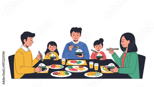 Happy family of five including two parents and three children sit around a table enjoying a traditional meal with rice and various dishes.