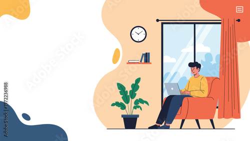 Young man sitting comfortably in an armchair at home and working on a laptop near a large window with a view of the garden in daylight.