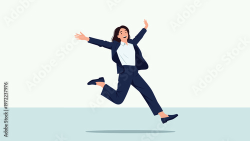 Cheerful businesswoman in a formal dark blue suit jumping high with pure joy against a neutral white background.
