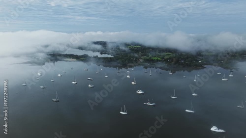Aerial morning fog over boats in Kerikeri Inlet Bay of Islands New Zealand coastal landscape
