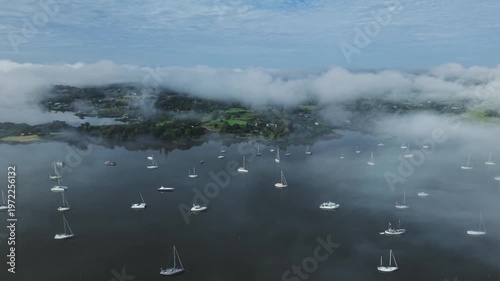Calm morning fog over anchored boats in Kerikeri Inlet Bay of Islands New Zealand
