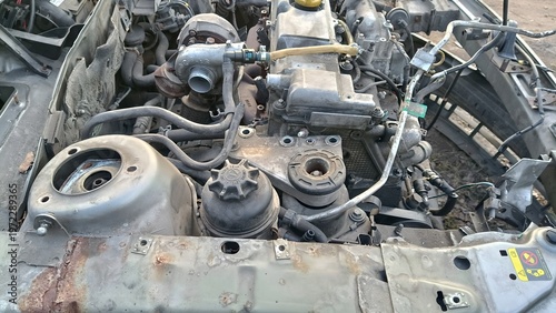 Tableau sur toile Scrap metal and engine parts of a disassembled car