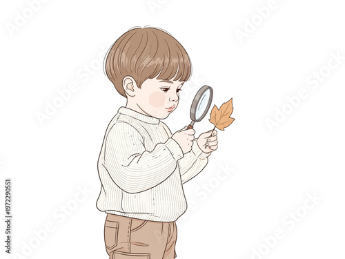 Young boy intently examining a leaf with a magnifying glass.