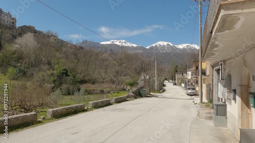 Panoramic view of the Italian village Castel San Vincenzo with snow-capped mountains