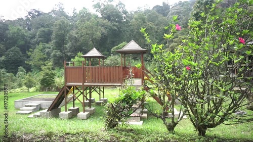 Wallpaper Mural Wooden children’s play structure in a natural park with a fresh and lush atmosphere. Torontodigital.ca