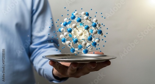 Scientist's hand presents an intricate molecular structure model floating above a silver tray, symbolizing innovation in research