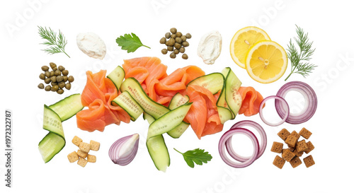 Smoked salmon slices with cucumber, red onion, capers, cream cheese, lemon, dill, parsley and croutons isolated on transparent background