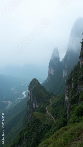 Misty mountains with rock formations on top