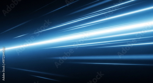 Fotografie A bright blue light streaking across a dark background with radiant beams of lig