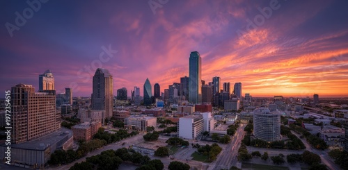 Dallas Skyline at Sunset with Vibrant Orange and Purple Clouds.