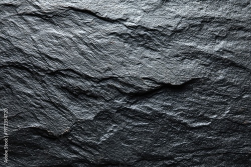 Close-up Texture of Dark Slate Rock Surface with Natural Layers.
