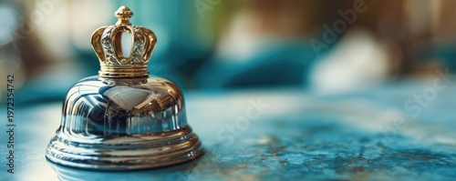 Elegant Golden Crown Bell on a Textured Surface.