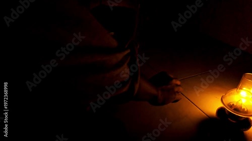 In a dimly lit room a man writes “Rain”, in that stillness. He finds that teaching doesn’t always come from people, sometimes it falls softly from the sky.