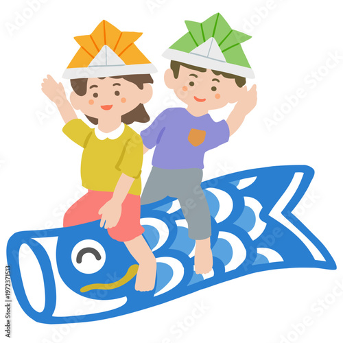 鯉のぼりに乗っている女の子と男の子