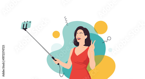Cheerful woman in a red dress taking a selfie with a selfie stick against a colorful abstract background with geometric shapes.