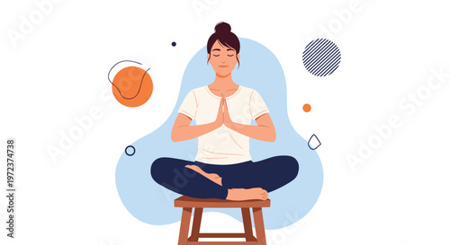 Peaceful woman sitting in a meditative lotus pose on a wooden stool with her hands joined together against an abstract background.