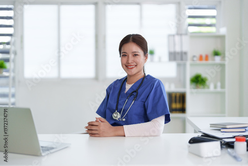 Canvas-taulu Asian adult medical professional nurse doctor smiling confidently posing working