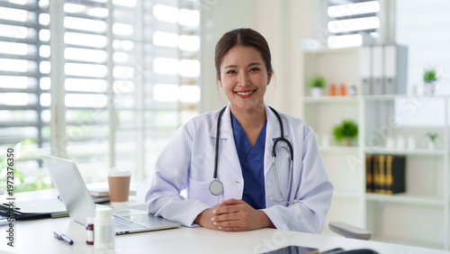 Photos Asian adult female doctor professional smiles confidently medical expert health