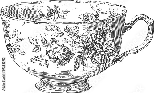 Vintage floral teacup with intricate rose patterns and handle on white background