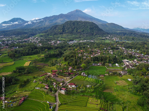 Photos Aerial view of Mount Welirang with terraced rice fields, rural village settlemen