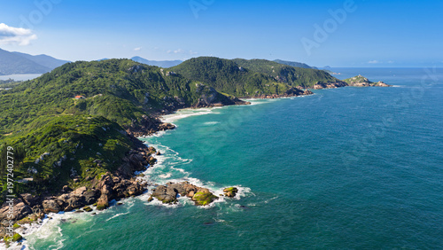 Billede på lærred Aerial view of rocky headland with lush green hills and turquoise Atlantic Ocean, Florianopolis