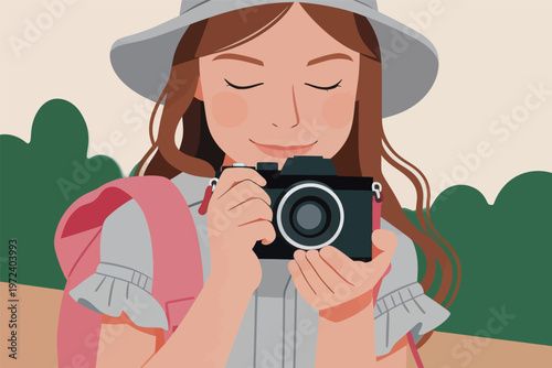 Young woman holds camera with smile in outdoor setting, ready to take a picture on a sunny day