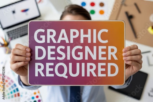 Person Holding Graphic Designer Required Sign Creative Career Hiring and Design Industry Recruitment Concept