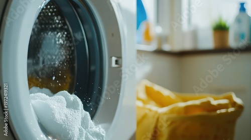 Laundry in washing machine, foamy clothes