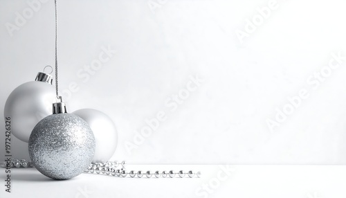 Elegant Christmas Ornaments - Silver Spheres and Festive Decorations.