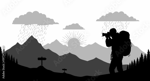 Silhouette of photographer in mountains capturing landscape with rain