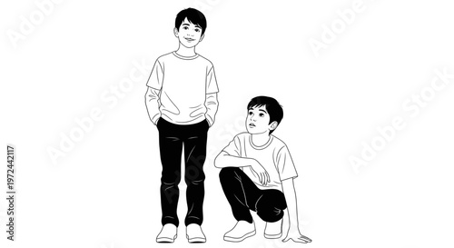 Two young boys, one standing, one crouching, isolated on white background