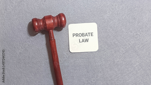 Probate law concept with a gavel and a card, symbolizing legal proceedings and estate settlement, legal justice