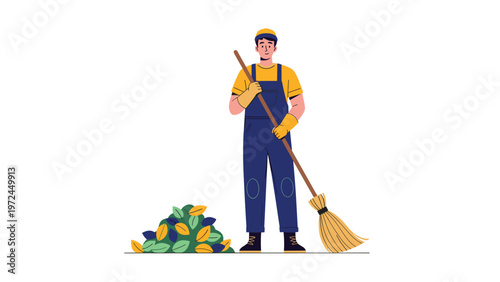 Diligent janitor in blue overalls and a yellow cap holds a straw broom next to a pile of colorful autumn leaves.