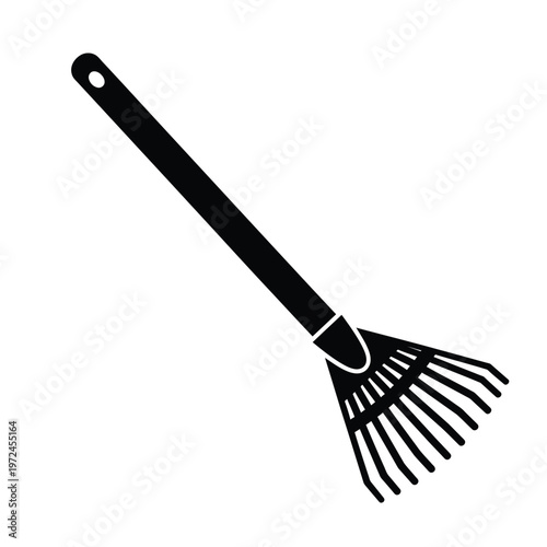 A simple black silhouette depicts a garden leaf rake with a long handle and curved tines