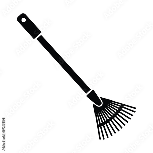 A simple black silhouette depicts a garden leaf rake a common tool for yard work and cleanup
