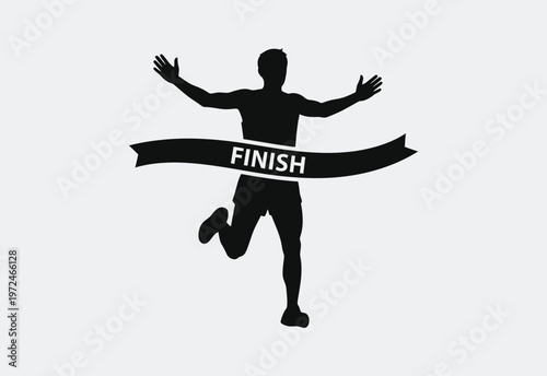 A silhouette of a man kneeling on the ground while cooking food over an open campfire outdoors