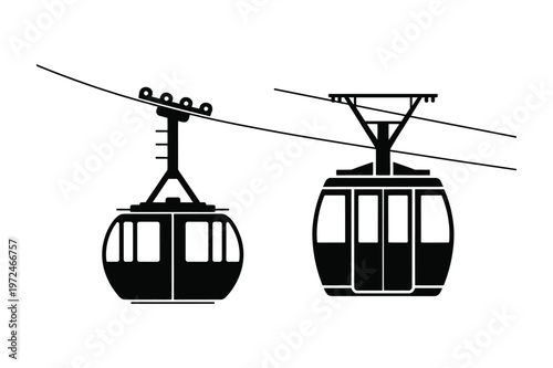 Two cable car silhouettes suspended on wires