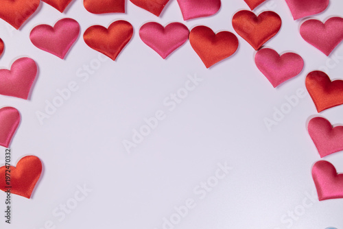 Red hearts at the top on a white background. Valentine's Day. Space for text.