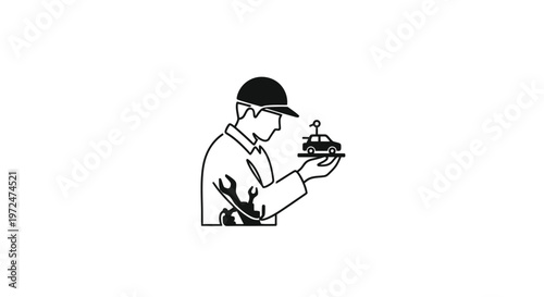 Mechanic holding miniature car model with antenna in hand